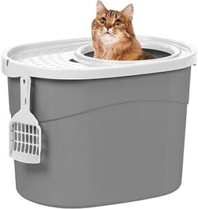 A gray litter box with a scooper and a white lid that has a circular opening where an orange cat is peeking its head out of