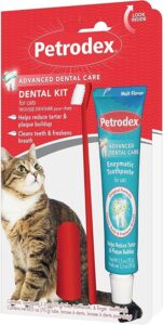 A red package containing a cat toothbrush and malt-flavored toothpaste from the brand Petrodex